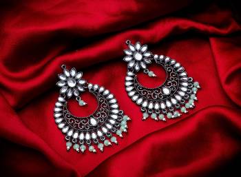 Grab These Beautiful Pair Of Earrings In Silver Color Beautified With Stone And Pearl Work. You Can Pair This Up With Any Kind Of Kurti, Suit Or Lehenga. Buy Now.