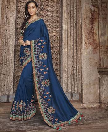 Go With The Shades Of Pretty Of Blue With This Heavy Designer Saree In Royal Blue Color Paired With Turquoise Blue Colored Blouse. This Saree And Blouse Are Silk Based Beautified With Heavy Embroidery Over The Saree And Blouse Both. 