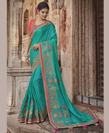 Look Beautiful In This Pretty Designer Saree In Sky Blue Color Paired With Contrasting Fuschia Pink Colored Blouse. This Silk Based Saree And Blouse Are Beautified With Detailed Embroidery Giving An Enhanced Look. 