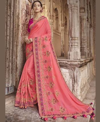 You Will Definitely Earn Lots Of Compliments Wearing This Heavy Designer Saree In Pink Color Paired With Dark Pink Colored Blouse. This Saree And Blouse Are Fabricated On Art Silk Beautified With Embroidery. Its Pretty Color Pallete And Rich Silk Fabric Will Earn You Lots Of Compliments From Onlookers. 