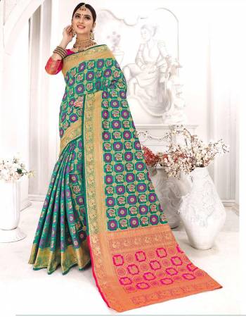 Here Is A Rich Designer Heavy Weaved Saree In Teal Green Color Paired With Contrasting Rani Pink Colored Blouse. This Saree And Blouse Are Silk Based Which Is Durable, Light Weight And Easy To Care For.