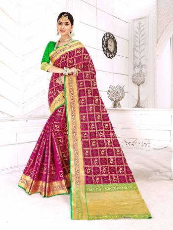 For A Royal Look, Grab This Heavy Weaved Designer Saree In Magenta Pink color Paired With Contrasting Green Colored Blouse. This Saree And Blouse are Silk Based Beautified With Weave All Over. Buy Now.