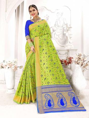 Bright And Visually Appealing Color Is  Here With This Designer Silk Based Saree In Parrot Green Color Paired With Contrasting Royal Blue Colored Blouse. It Has Pretty Detailed Weave All Over Saree Giving It A Significant Look. 