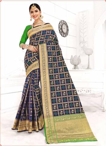 Bold And Beautiful Color Is  Here With This Designer Silk Based Saree In Navy Blue Color Paired With Contrasting Green Colored Blouse. It Has Pretty Detailed Weave All Over Saree Giving It A Significant Look. 