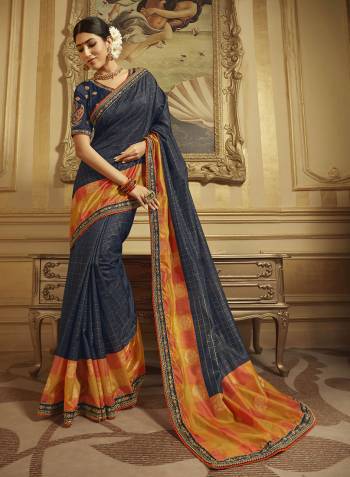 Enhance Your Personality Wearing This Rich Looking Designer Saree In Navy Blue Color Paired With Navy Blue Colored Blouse. It Is Beautified Witg Foil Printed Checks And Embroidery. 