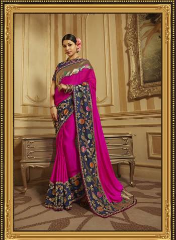 Bright And Visually Appealing Color Is Here With This Heavy Designer Saree In Rani Pink Color Paired With Contrasting Navy Blue Colored Blouse. This Saree And Blouse Are Silk Based Beautified With Bold Weave And Embroidery. 