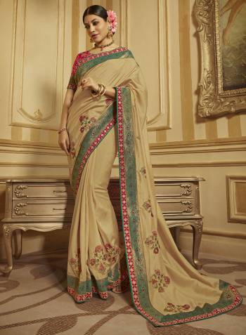 Flaunt Your Rich And Elegant Taste Wearing This Designer Saree In Beige Color Paired With Dark Pink Colored Blouse. This Saree And Blouse are Fabricated On Art Silk And Jacquard Silk Beautified With Weave And Embroidery. 