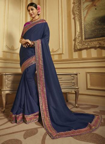 Here Is A Rich Designer Saree In Navy Blue Color Paired With Contrasting Dark Pink Colored Blouse. This Saree And Blouse Are Fabricated On Art And Jacquard Silk Paired With Art Silk Fabricated Blouse. Buy This Lovely Designer Piece Now.