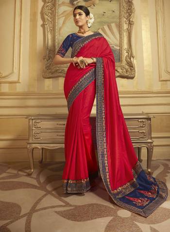 You Will Definitely Earn Lot Of Compliments Wearing This Elegant Looking Designer Saree In Red Color Paired With Navy Blue Colored Blouse. This Saree Is Fabricated On Art Silk And Jacquard Silk Beautified With Detailed Embroidery And Weave. Buy This Lovely Saree Now.