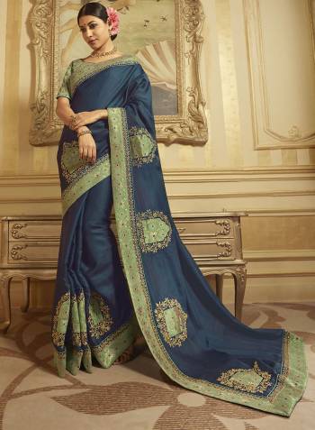 Flaunt Your Rich And Elegant Taste Wearing This Designer Saree In Blue Color Paired With Pastel Green Colored Blouse. This Saree And Blouse are Fabricated On Art Silk And Jacquard Silk Beautified With Weave And Embroidery. 