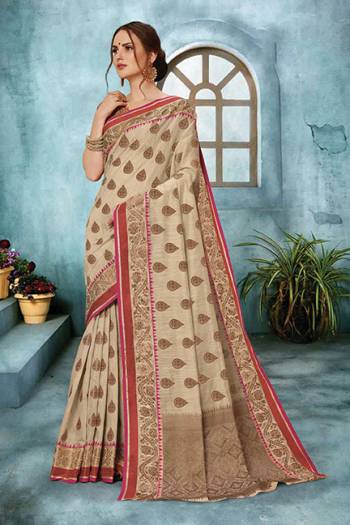 This Festive Season Look The Most Elegant Of All In This Pretty Cream Colored Saree. This Weaved Saree Is Fabricated On Cotton Art Silk Paired With Jacquard Silk Fabricated Blouse. It Is Light In Weight, Durable And Easy To Care For. 