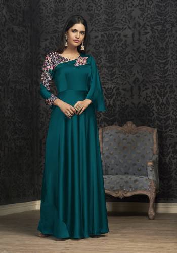 Here Is A Solution For Your Party Wear Dresses With This Designer Readymade Gown In Teal Blue Color Fabricated On Glowing Georgette. It Has Very Beautiful Pattern With Detailed Embroidery And Available In All Regular Sizes. Buy Now.