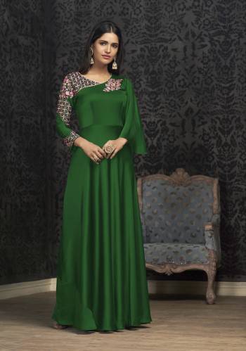 Here Is A Solution For Your Party Wear Dresses With This Designer Readymade Gown In Dark Green Color Fabricated On Glowing Georgette. It Has Very Beautiful Pattern With Detailed Embroidery And Available In All Regular Sizes. Buy Now.