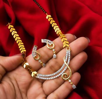 Grab This Very Pretty Mangalsutra Set With A Whole New Design And Pattern. This Pretty Set Can Be Paired With Any Colored Ethnic Attire. It Is Light Weight And Easy To Carry All Day Long.