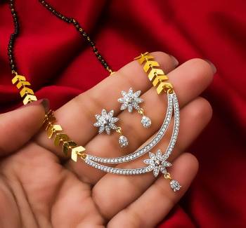 Grab This Very Pretty Mangalsutra Set With A Whole New Design And Pattern. This Pretty Set Can Be Paired With Any Colored Ethnic Attire. It Is Light Weight And Easy To Carry All Day Long.