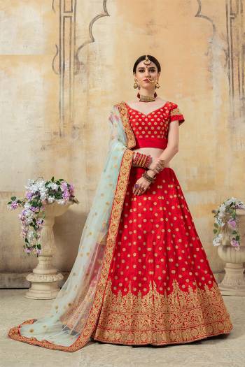 Lovely Color Pallete Is Here With This Heavy Designer Lehenga Choli In Red Color Paired With Contrasting Baby Blue Colored Dupatta. Its Heavy Embroidered Blouse And Lehenga Are Fabricated On Art Silk Paired With Net Fabricated Dupatta. 