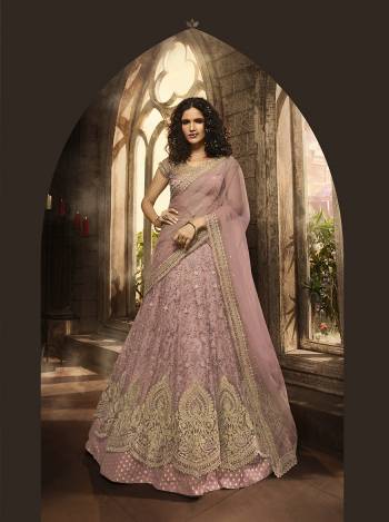 New Shade In Purple Is Here With This Heavy Designer Lehenga Choli In Lilac Color. Its Blouse, Lehenga And Dupatta Are Fabricated On Net Beautified With Heavy Jari And Resham Embroidery With Stone Work. Buy Now.