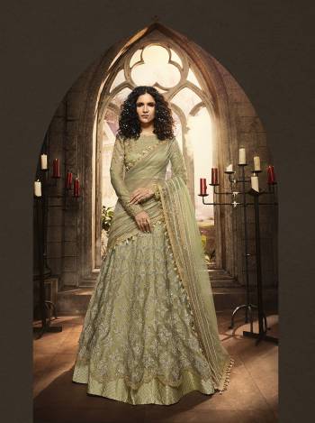 This Season Is About Subtle Shades And Pastel Play, So Grab This Heavy Designer Lehenga Choli In Pastel Green Color Paired With Pastel Green Colored Dupatta. It Is Beautified With Heavy Contrasting Embroidery And Jari Work. Buy This Pretty Piece Now.