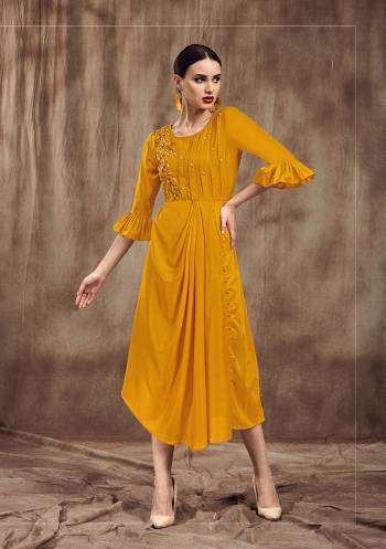 Celebrate This Festive Season Wearing This Designer Drape Patterened Readymade Kurti In Musturd Yellow Color . This Pretty Kurti Is Fabricated On Mulsin And Beautified With Embroidery. 