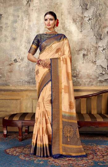 Look Elegant With This Rich Looking Silk Based Saree In Light Peach Color Paired With Contrasting Navy Blue Colored Blouse. This Saree Is Fabricated On Art Silk Paired With Jacquard Silk Fabricated Blouse. It Is Beautified With Elegant Weave Giving An Attractive Look. 