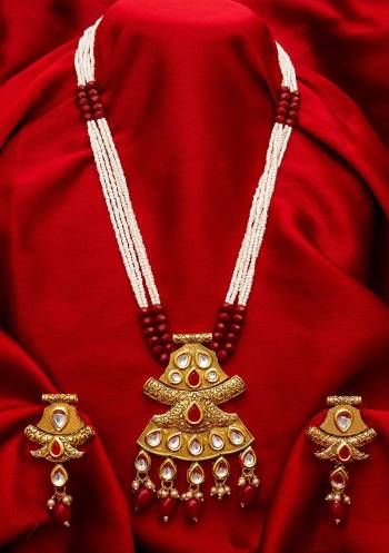 Give An Enhanced Look To Your Personality By Pairing Up This Beautiful Necklace Set With Your Ethnic Attire. This Pretty Set Is In Golden Color Beautified With Stone And Pearl Work. Buy Now.