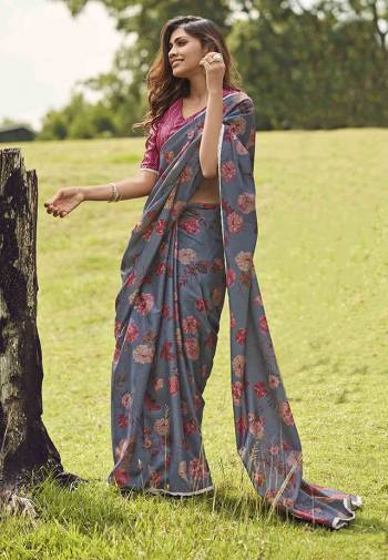 Add This Lovely Shade To Your Wardrobe With This Designer Floral Printed Saree In Steel Blue Color Paired With Contrasting Dark Pink Colored Blouse. This Saree And Blouse Are Fabricated On Manipuri Art Silk Which Gives A Rich Look To Your Personality. 