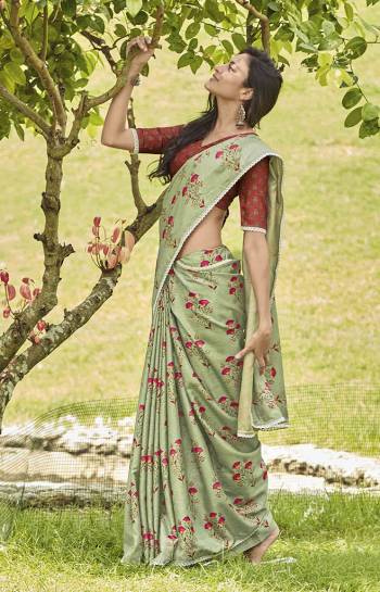 This Season Is About Subtle Shades And Pastel Play,. So Grab This Pretty Saree In Pastel Green Color Paired With Contrasting Rust Red Colored Blouse. This Saree And Blouse Are Fabricated On Mainpuri Art Silk Beautified With Floral Prints. 