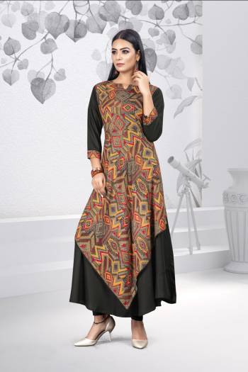 Grab This Designer Readymade Kurti For The Upcoming Festive Season. This Kurti Is Rayon Based Beautified With Prints. 