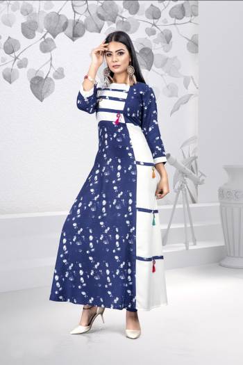 Simple And Elegant Looking Kurti Is Here For Your Casual And Semi-Casual Wear. This Pretty Kurti Is Fabricated On Rayon Beautified With Prints All Over. 