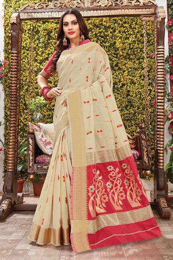 Flaunt Your Rich And Elegant Taste Wearing This Rich Silk Based Saree In Cream Color Paired With Contrasting Red Colored Blouse. This Saree Is Fabricated On Cotton Silk Paired With Art Silk Fabricated Blouse. Its Rich Color Pallete And Fabric Will Definitely Earn You Lots Of Compliments From Onlookers.