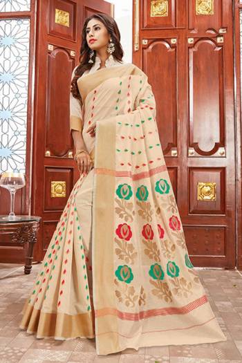 Flaunt Your Rich And Elegant Taste Wearing This Rich Silk Based Saree In Cream Color Paired With Contrasting Red Colored Blouse. This Saree Is Fabricated On Cotton Silk Paired With Art Silk Fabricated Blouse. Its Rich Color Pallete And Fabric Will Definitely Earn You Lots Of Compliments From Onlookers.