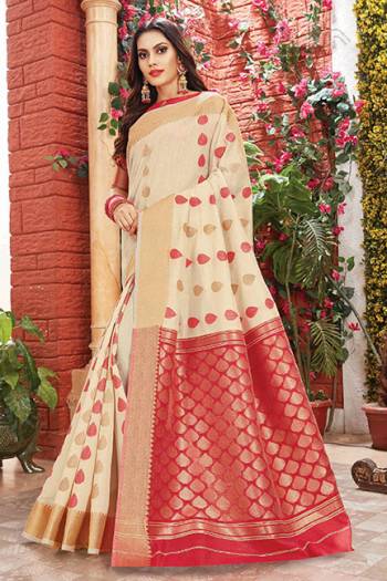 Flaunt Your Rich And Elegant Taste Wearing This Rich Silk Based Saree In Cream Color Paired With Contrasting Red Colored Blouse. This Saree Is Fabricated On Cotton Silk Paired With Art Silk Fabricated Blouse. Its Rich Color Pallete And Fabric Will Definitely Earn You Lots Of Compliments From Onlookers.