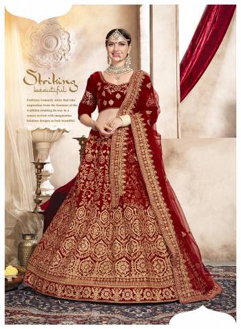 This Wedding Season, Grab This Very Beautiful Heavy Designer Lehenga Choli In Maroon Color. Its Pretty Blouse And Lehenga Are Fabricated On Velvet Paired With Net Fabricated Dupatta. It Is Beautified With Heavy Jari Embroidery And Stone Work. 