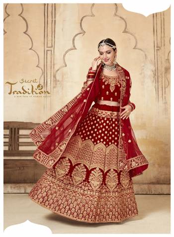 This Wedding Season, Grab This Very Beautiful Heavy Designer Lehenga Choli In Maroon Color. Its Pretty Blouse And Lehenga Are Fabricated On Velvet Paired With Net Fabricated Dupatta. It Is Beautified With Heavy Jari Embroidery And Stone Work. 