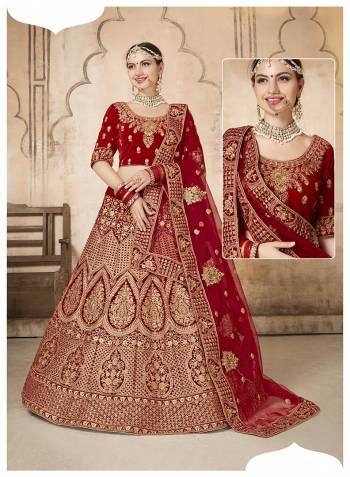 This Wedding Season, Grab This Very Beautiful Heavy Designer Lehenga Choli In Maroon Color. Its Pretty Blouse And Lehenga Are Fabricated On Velvet Paired With Net Fabricated Dupatta. It Is Beautified With Heavy Jari Embroidery And Stone Work. 