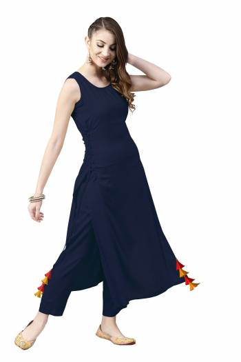 Grab This Pretty Readymade Designer Kurti In Navy Blue Color Fabricated On Rayon. It Has Very Pretty Side Pattern With Tassels. Buy This Lovely Kurti Now.