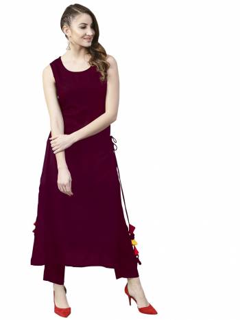 Grab This Pretty Readymade Designer Kurti In Magenta Pink Color Fabricated On Rayon. It Has Very Pretty Side Pattern With Tassels. Buy This Lovely Kurti Now.