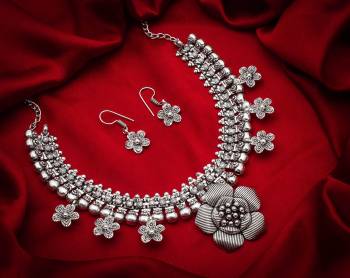 Give An Enhanced Look To Your Personality By Pairing Up This Beautiful Necklace Set With Your Ethnic Attire. This Pretty Set Is In Silver Color Which Can Be Paired With Any Colored Attire. Buy Now.