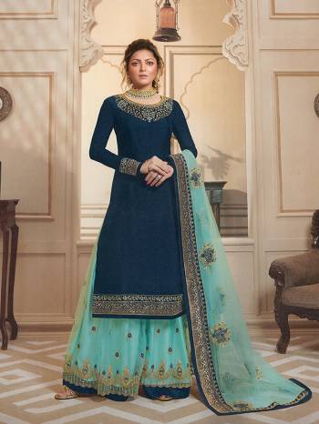 Go With The Shades Of Blue Wearing This Heavy Designer Sharara Suit In Navy Blue Colored Top And Bottom Paired With Turquoise Blue Colored Sharara And Dupatta. Its Top Is Fabricated On Satin Georgette Paired With Santoon Bottom, Georgette Fabricated Sharara And Dupatta. Buy Now.