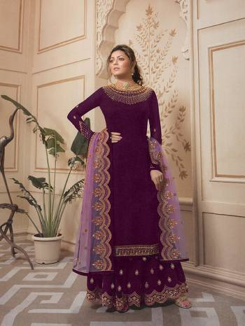 This Festive Season Look The Most Elegant Of All Wearing This Designer Suit In Wine Colored Top, Bottom And Sharara Paired With A Very Pretty Light Purple Colored Dupatta. Its Top Is Satin Georgette Based Paired With Santoon Bottom And Georgette Fabricated Sharara And Dupatta. 