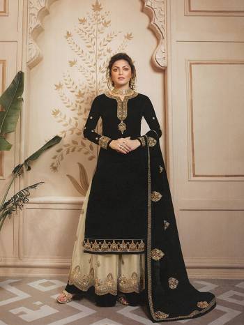 For A Bold And Beautiful Look, Grab This Designer Two-Way Suit In Black Paired With Cream Colored Sharara. Its Top Is Fabricated On Satin Georgette Paired With Santoon Bottom And Georgette Fabricated Sharara And Dupatta. 