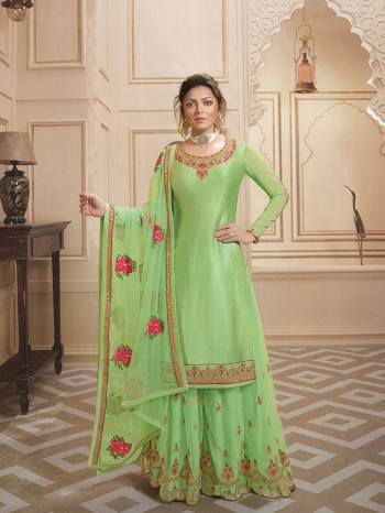 Celebrate This Festive Season In Very Pretty All Over Light Green Colored Designer Suit. This Suit Comes With Two Bottoms You can Pair It Up As Per The Occsion. Its Top Is Fabricated On Satin Georgette Paired With Santoon Bottom And Georgette Fabricated Sharara And Dupatta. 