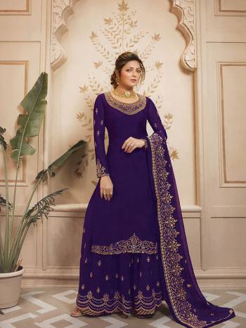 Celebrate This Festive Season In Very Pretty All Over Violet Colored Designer Suit. This Suit Comes With Two Bottoms You can Pair It Up As Per The Occsion. Its Top Is Fabricated On Satin Georgette Paired With Santoon Bottom And Georgette Fabricated Sharara And Dupatta. 