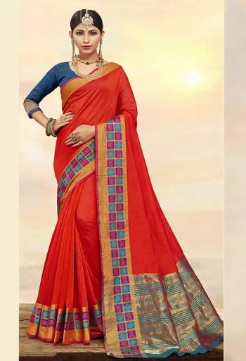 Flaunt Your Rich And Elegant Taste Wearing This Designer Saree In Orange Color Paired With Contrasting Navy Blue Colored Blouse. This Saree Is Fabricated On Cotton Silk Paired With Art Silk Fabricated Blouse. It Is Beautified With Weaved Border. 