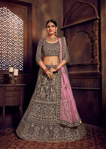 Rich And Elegant Looking Heavy Designer Lehenga Choli Is Here In Lovely Grey Color Paired With Contrasting Lilac Colored Dupatta. This Pretty Heavy Embroidered Lehenga Choli And Dupatta Are Fabricated On Net. Buy Now.