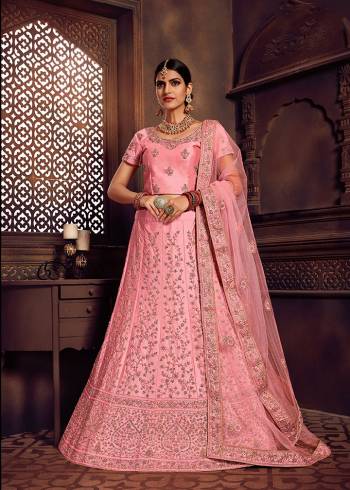 Look Pretty In This Heavy Designer Lehenga Choli In All Over Pink Color. Its Blouse And Lehenga Are Fabricated On Art Silk Paired With Net Fabricated Dupatta. It Is Beautified With Heavy Embroidery Giving It An Attractive Look. 