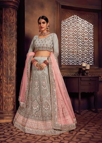 Rich And Elegant Looking Heavy Designer Lehenga Choli Is Here In Lovely Light Grey Color Paired With Contrasting Pastel Pink Colored Dupatta. This Pretty Heavy Embroidered Lehenga Choli And Dupatta Are Fabricated On Net. Buy Now.