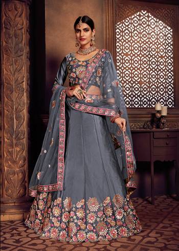 Look Pretty In This Heavy Designer Lehenga Choli In All Over Grey Color. Its Blouse And Lehenga Are Fabricated On Art Silk Paired With Net Fabricated Dupatta. It Is Beautified With Heavy Embroidery Giving It An Attractive Look. 