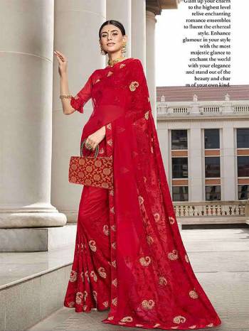 Adorn The Pretty Angelic Look Wearing This Designer Saree In Red Color Paired With Red Colored Blouse. This Saree Is Fabricated On Georgette Paired With Art Silk Fabricated Blouse. It Is Beautified With Heavy Embroidery Which Will Earn You Lots Of Compliments From Onlookers. 