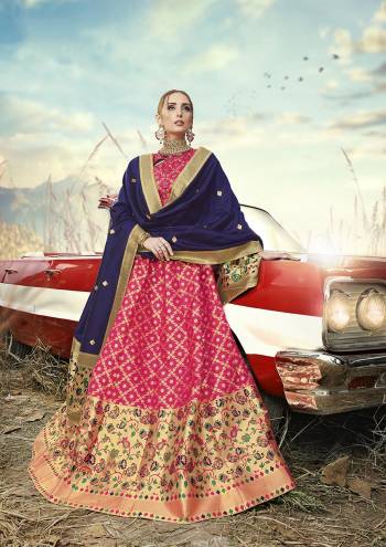 Go With Pretty Shades Wearing This Heavy Weaved Designer?Lehenga Choli In Rani Pink Color Paired With Contrasting Navy Blue Colored Dupatta. Its Blouse Is Fabricated On Banarasi Art Silk Paired With Banarasi Jacquard Silk Lehenga And Dupatta